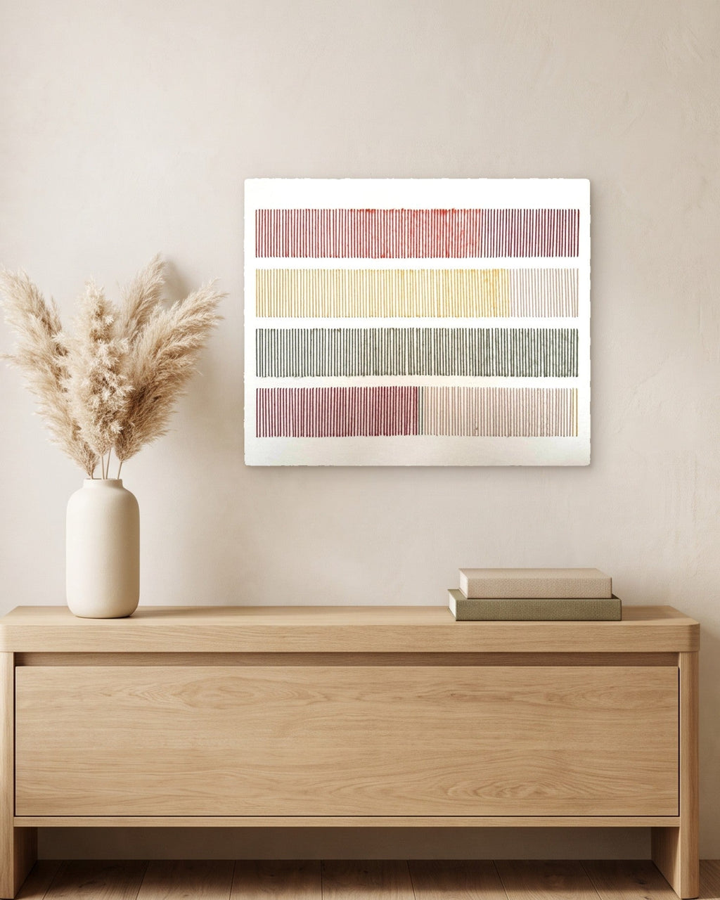 Cadence, hand-embroidered textile wall art, hanging above a light oak console with a vase of dried pampas grass and two books. AI-assisted lifestyle image: the setting is illustrative; please refer to our real product photographs for the actual item’s details.