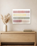 Cadence, hand-embroidered textile wall art, hanging above a light oak console with a vase of dried pampas grass and two books. AI-assisted lifestyle image: the setting is illustrative; please refer to our real product photographs for the actual item’s details.