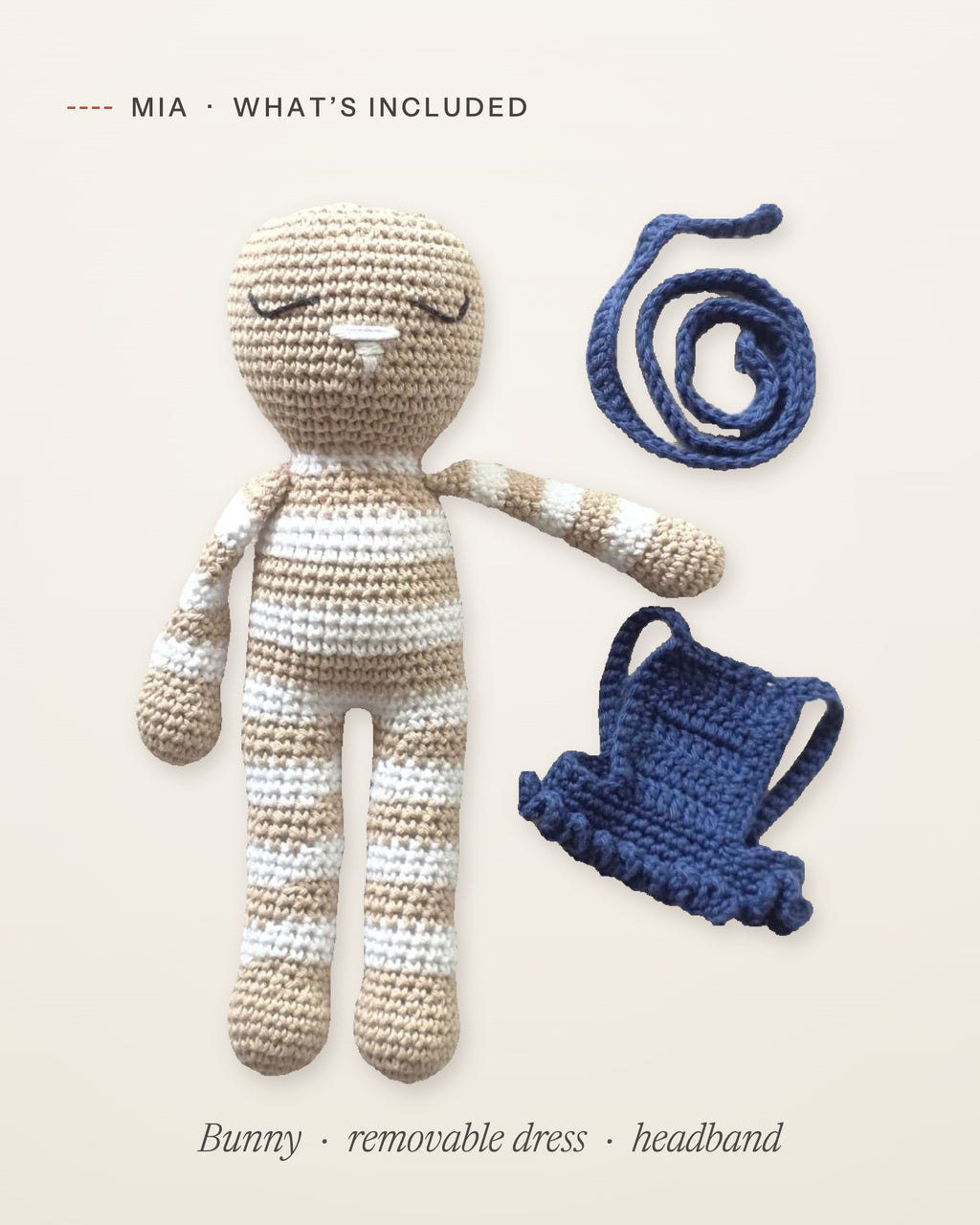 What’s included with Mia: the handmade crochet bunny, her removable navy blue dress and her headband, laid flat