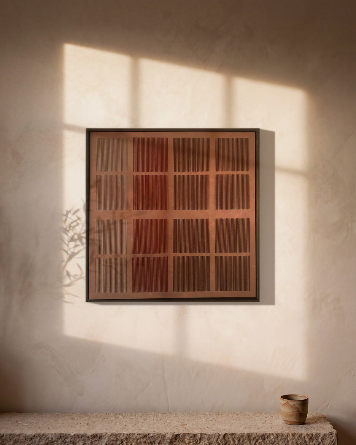 Refrain by Nyra Atelier: sixteen hand-woven macramé cord squares in taupe, rust, brick and brown on a hand-painted canvas in a wooden frame, shown in a styled room visualisation