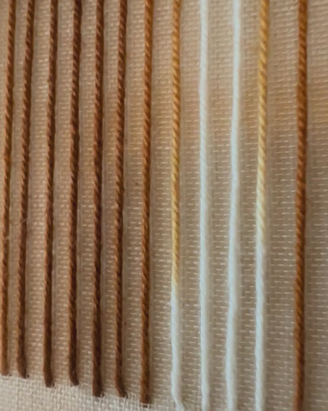 Video of Andante: from a close-up of the hand-stitched wool lines to the whole canvas on the wall