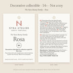 Hang tag of Rosa by Nyra Atelier: decorative collectible for collectors aged 14+, not a toy; materials, care and maker details