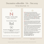 Hang tag of Sol by Nyra Atelier: decorative collectible for collectors aged 14+, not a toy; materials, care and maker details